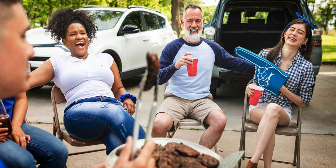 Friends eating and drinking at tailgate parties